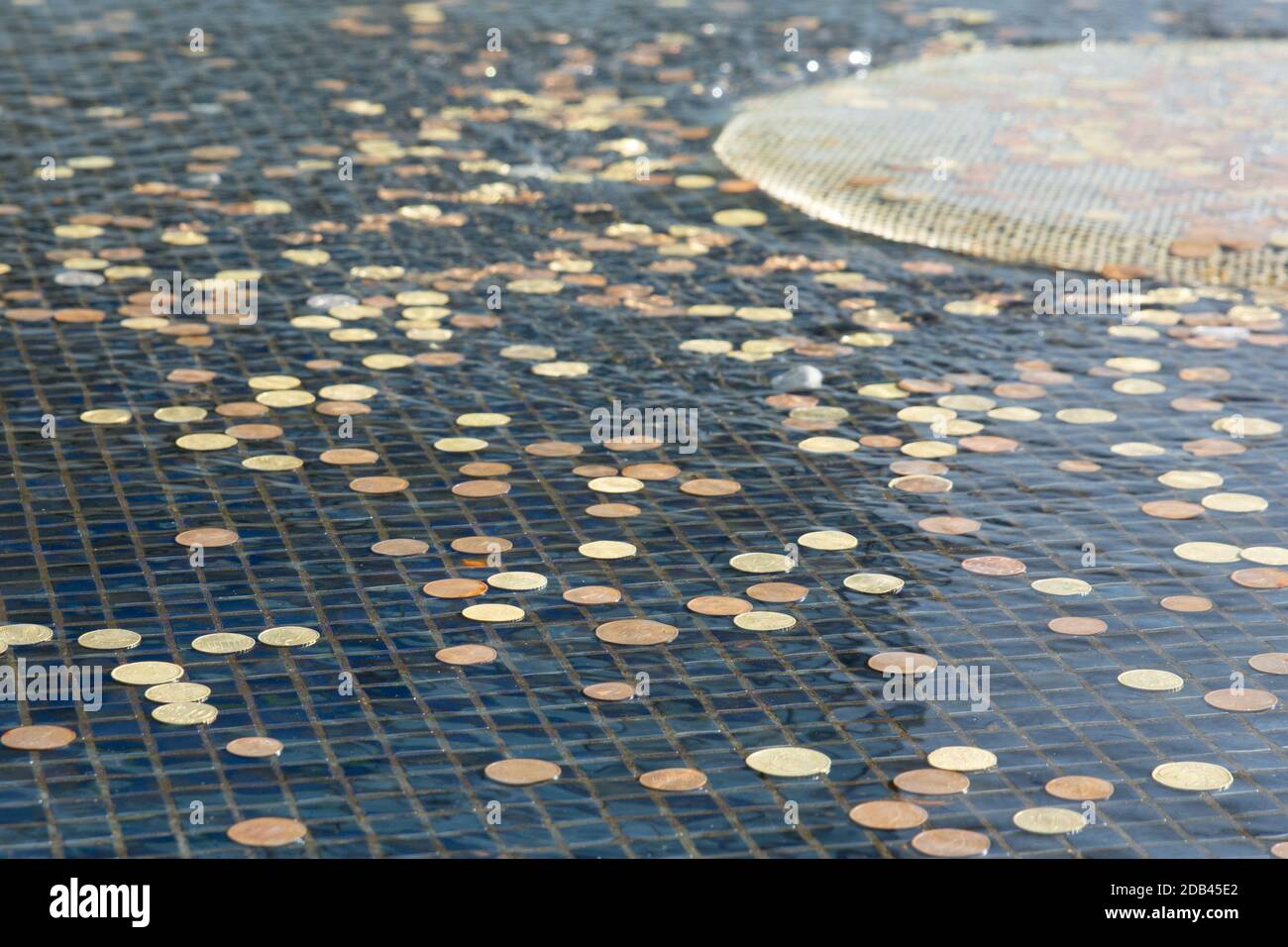 Euro coins in a fountain at Knock shrine in Ireland Stock Photo