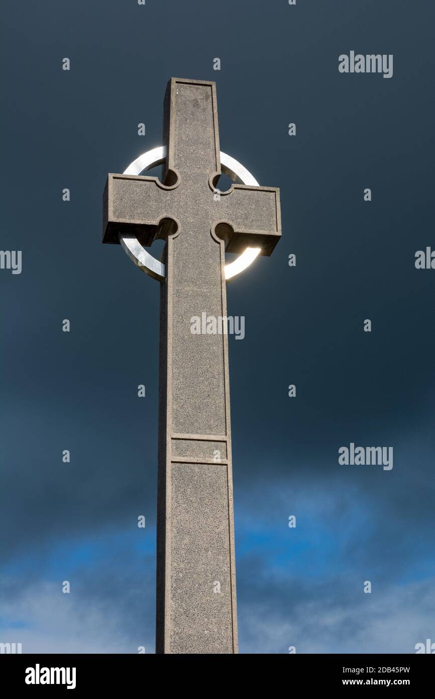 The Celtic Cross against dark skies at Ireland's national Marian shrine at Knock in County Mayo Stock Photo