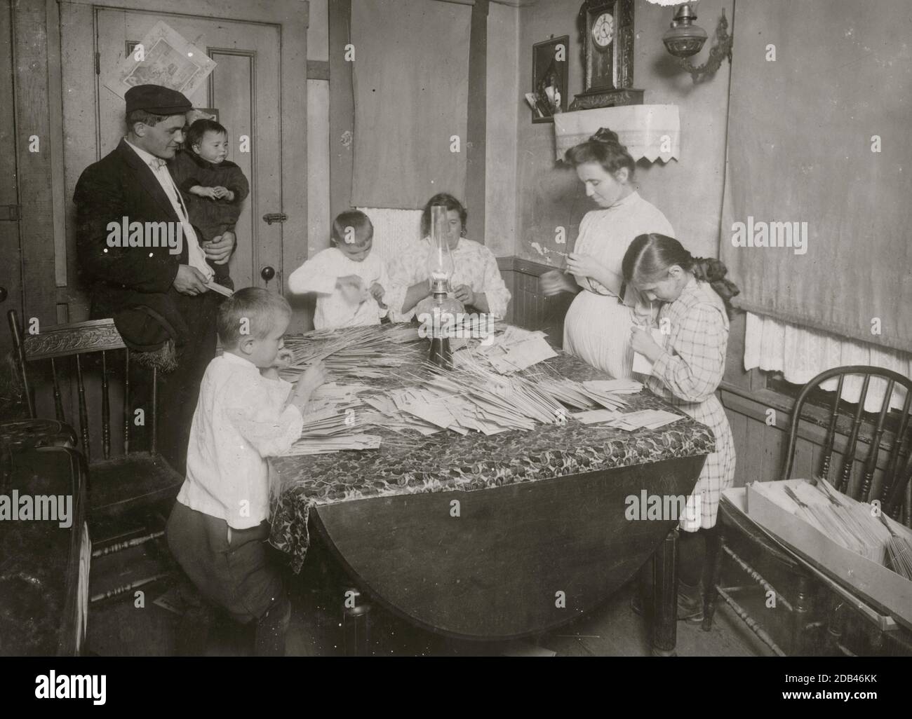Home of Rufine Morini, 6, Coburn Street, South Framingham, Mass. Two mothers, three children - 10, 8 and 6 years old, working on tags for Dennison. Children anemic. Make $10 (more or less) a month.. Stock Photo