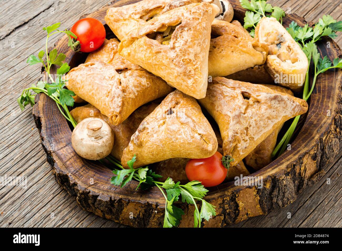 Traditional Russian sliced pie Kurnik close up on a slate board on the  table. vertical Stock Photo - Alamy