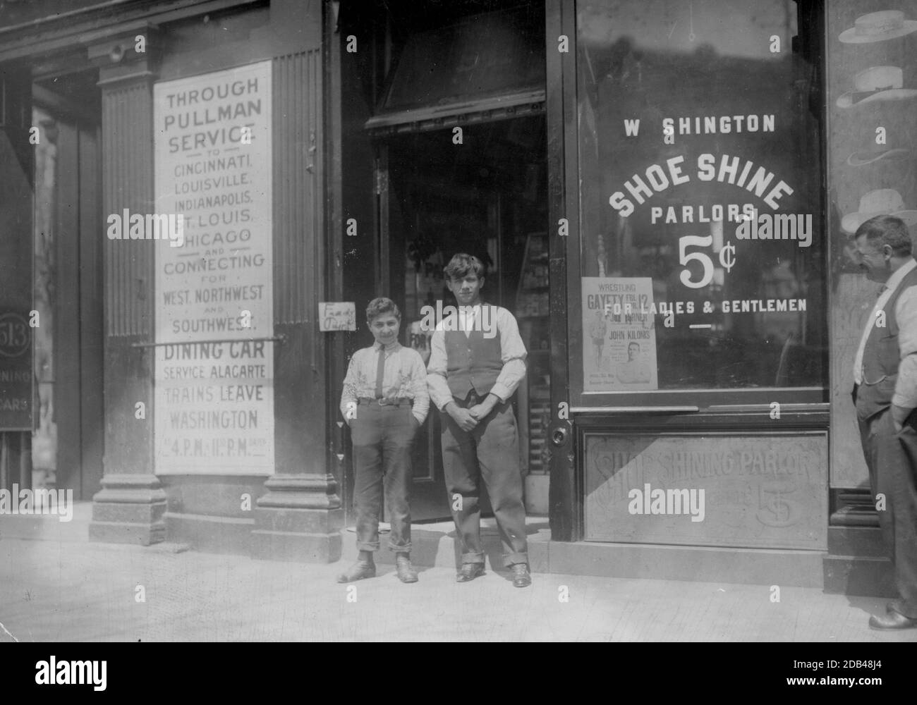 Young boy is Ciriakos Keiradimos, a young Greek shoe-shiner, working in shop at 511 Penn. Ave., N.W., Washington, D.C. Said to be 16 yrs. old, but is absolutely illiterate. Has been in this country only 2 months. Works until 9 P.M. every day and until 11 P.M. . Stock Photo