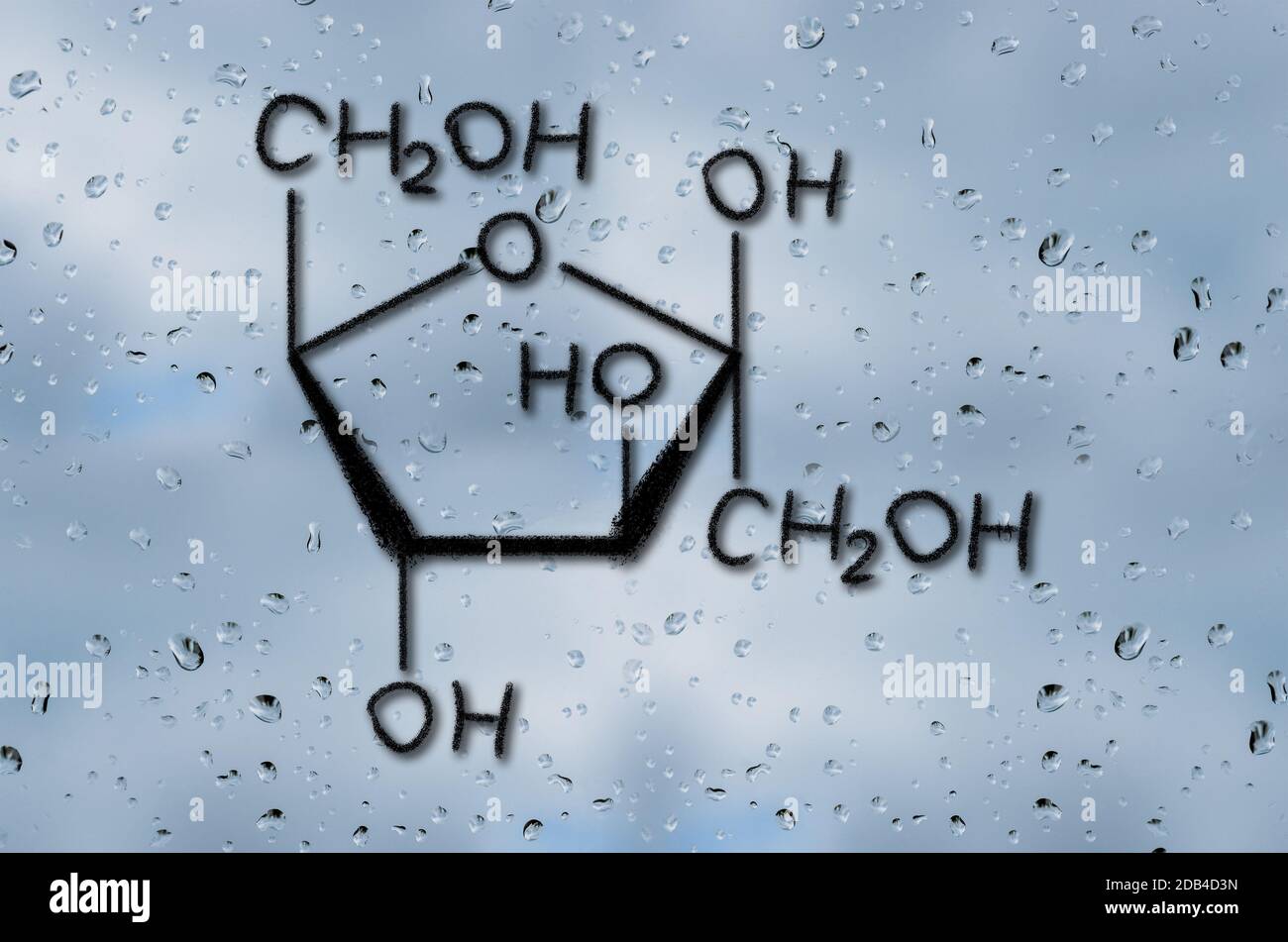 Fructose Model Building Structural model of Fructose drawn on the glass with raindrops Stock ...