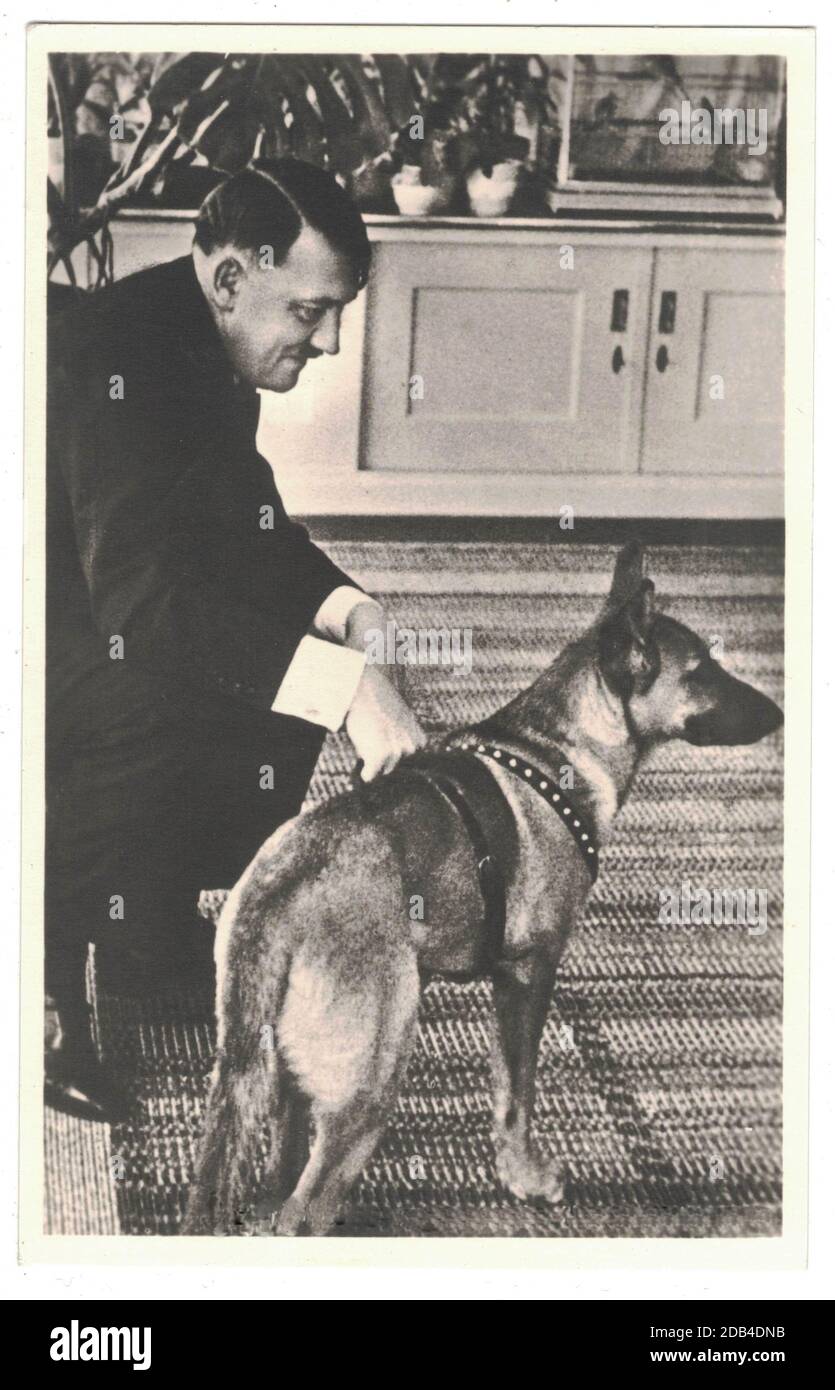 Adolf Hitler and his dog. Hitler was leader of nazi Germany. Reproduction of antique photo. Stock Photo