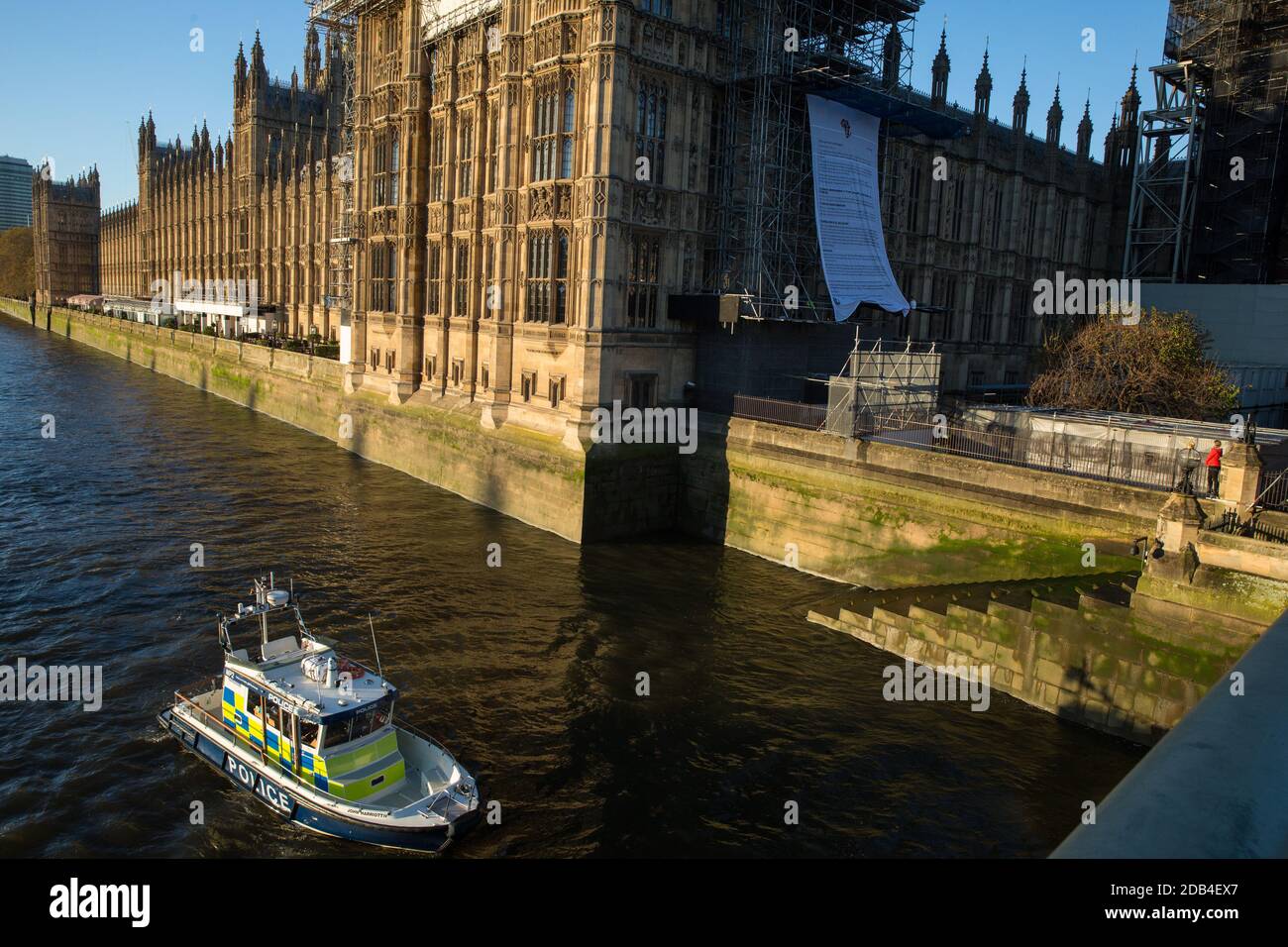 London, UK. 12th November, 2020. Activists from the group Action for Climate Truth and Reparations (ACTR) hang an open letter to the UK people from Africans Rising For Justice, Peace and Dignity from the Houses of Parliament. The letter, which launches Africans Rising’s ReRight History campaign, contains a plea to the UK people to start making amends for the harm caused by slavery and colonialism. Credit: Mark Kerrison/Alamy Live News Stock Photo