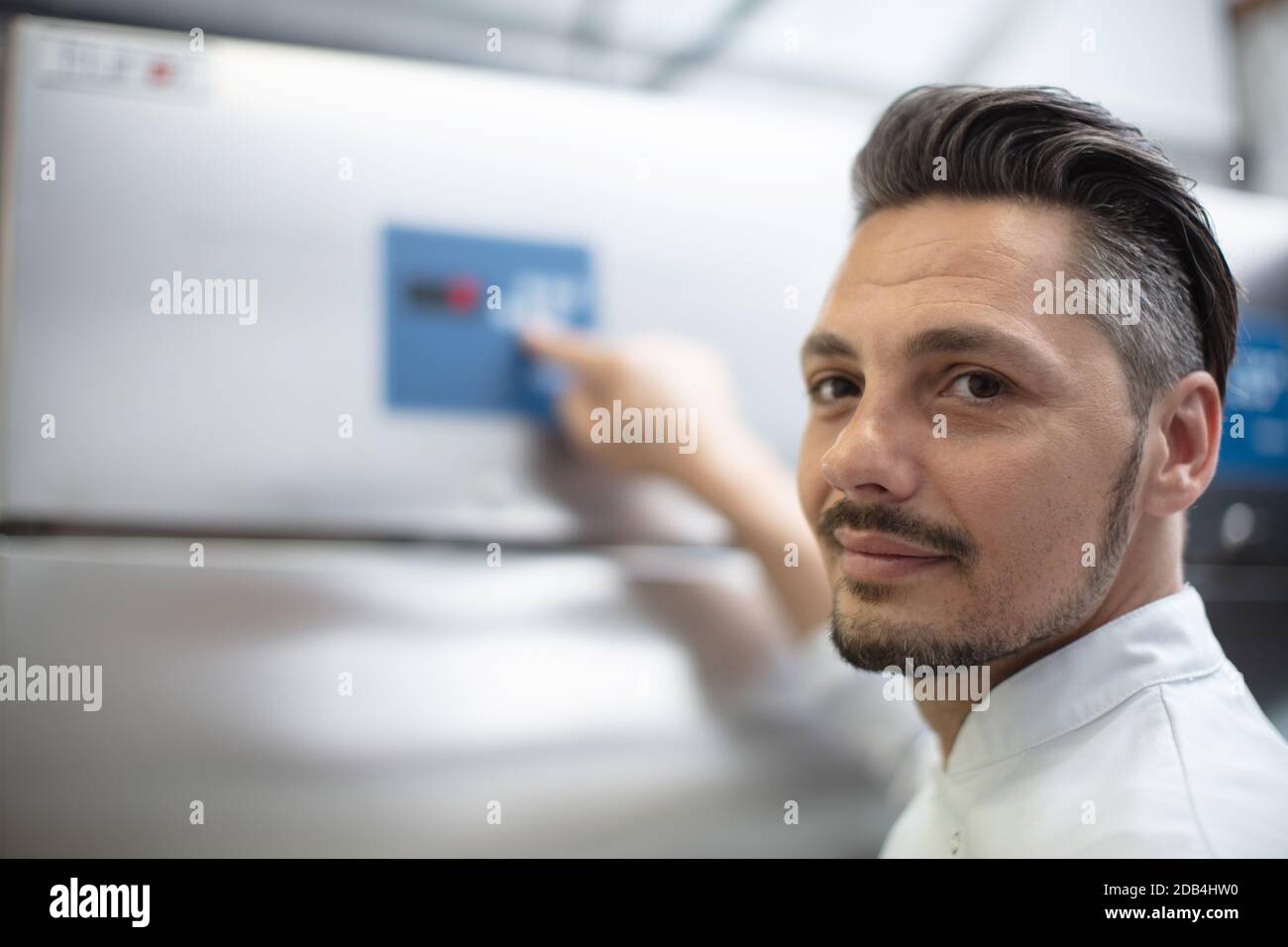 young factory technician psoing at workplace Stock Photo