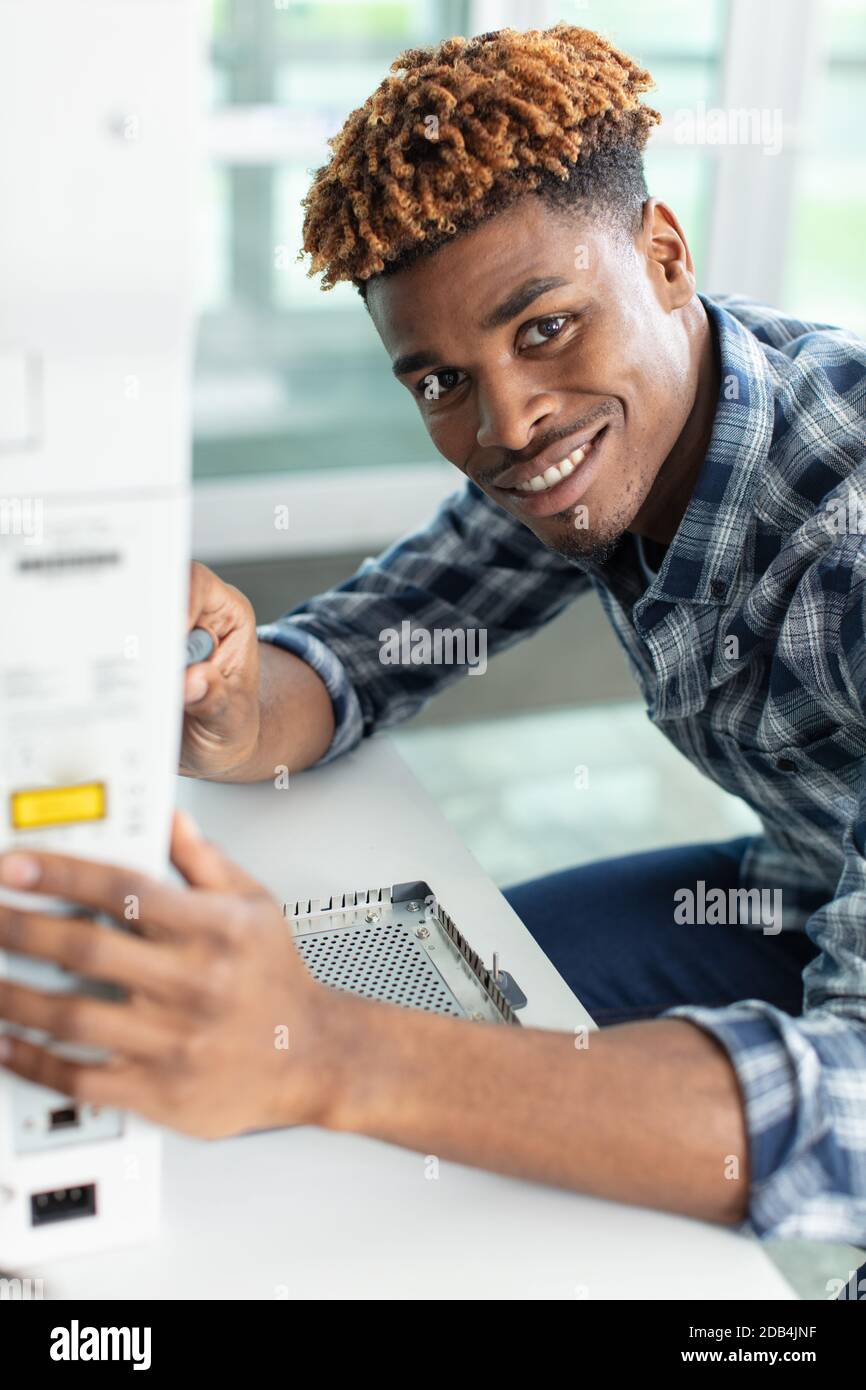 repairman working in technical support Stock Photo