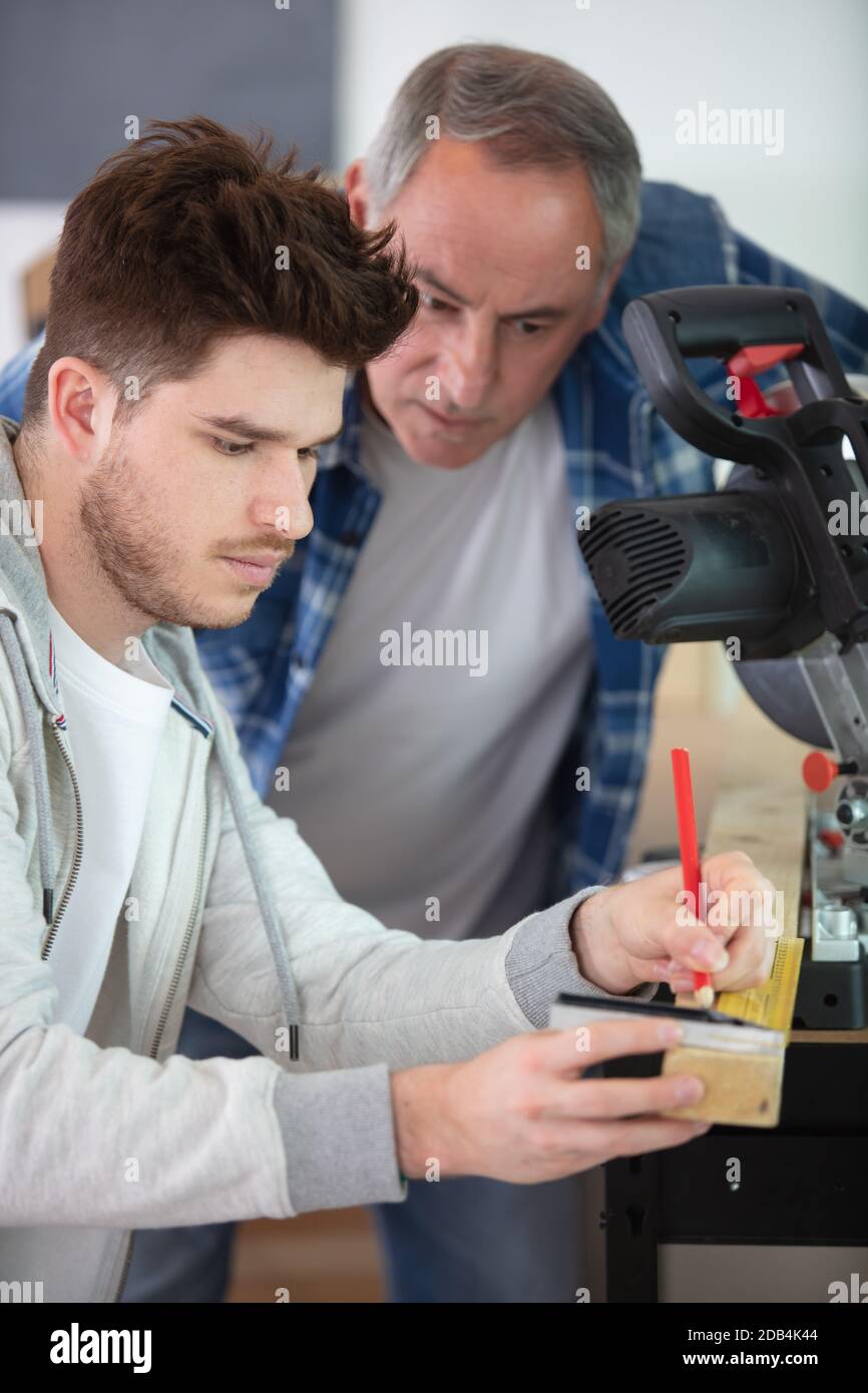 two wood designer working in workshop Stock Photo
