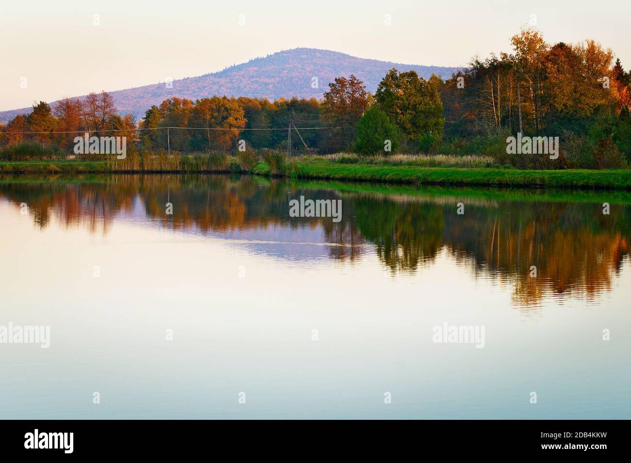 Ciekoty lake with view on Lysica mountain peak. Swietokrzyskie Mountains, Poland. Stock Photo