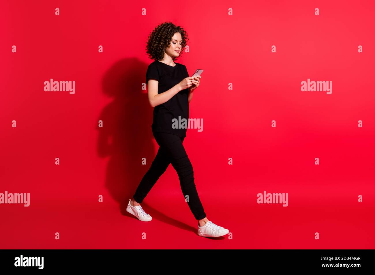 Full Body Profile Side Photo Of Young Lady Chat Read Browsing Modern Smartphone Wear Casual Outfit Isolated Over Red Color Background Stock Photo Alamy