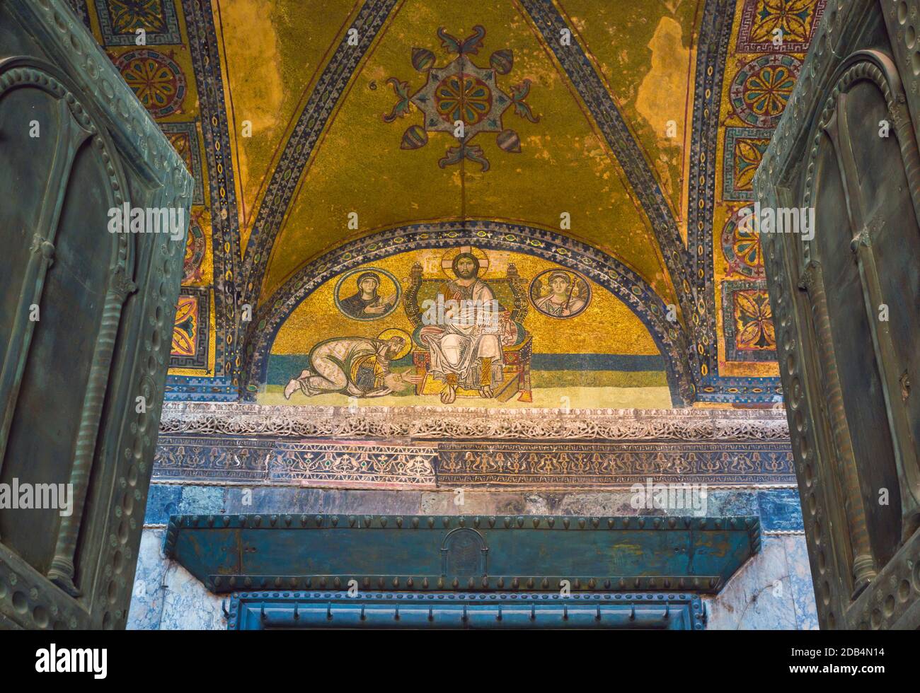 Istanbul, Turkey.  Hagia Sophia.  The Imperial Gate.  The mosaic above the door, dating from 9-10th century, shows Christ Pantocrator with an emperor Stock Photo