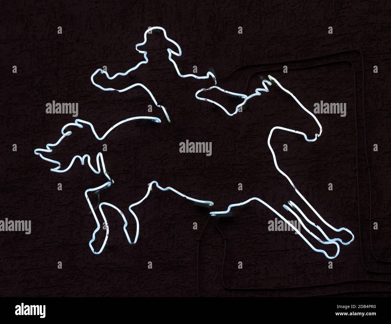 cowboy silhouette neon sign art Stock Photo - Alamy