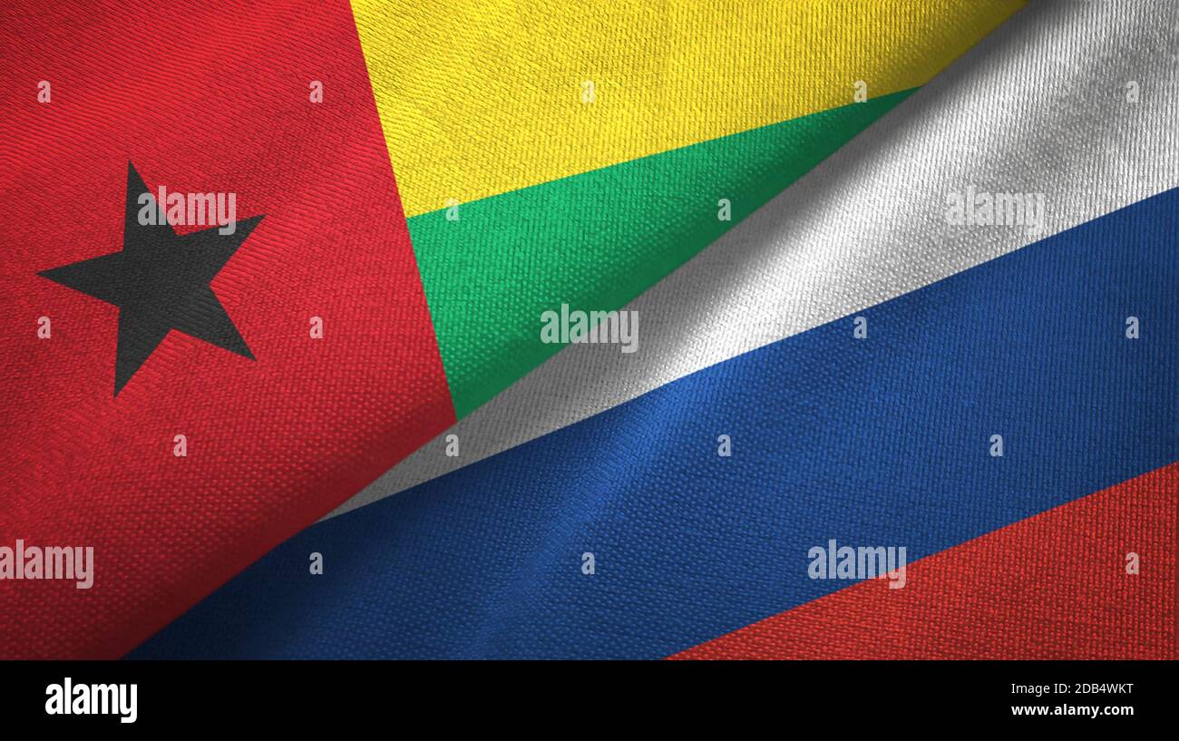 Guinea-Bissau and Russia two flags textile cloth, fabric texture Stock Photo