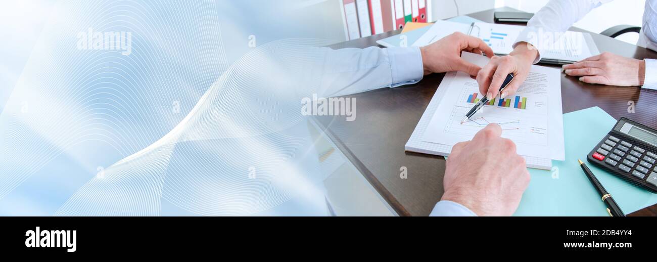 Two business people analyzing charts; panoramic banner Stock Photo - Alamy