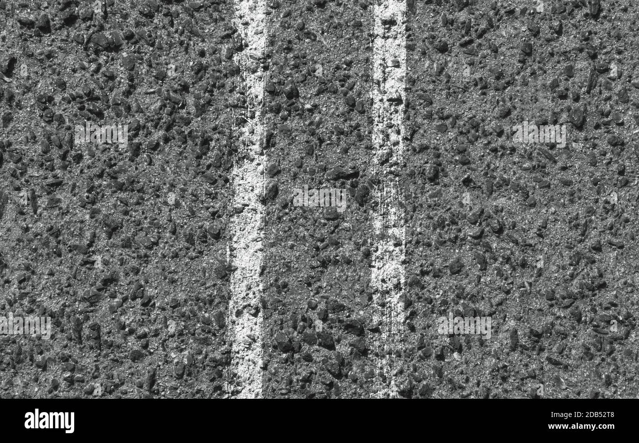 White stripes on the asphalt road. Top view. Background texture Stock Photo