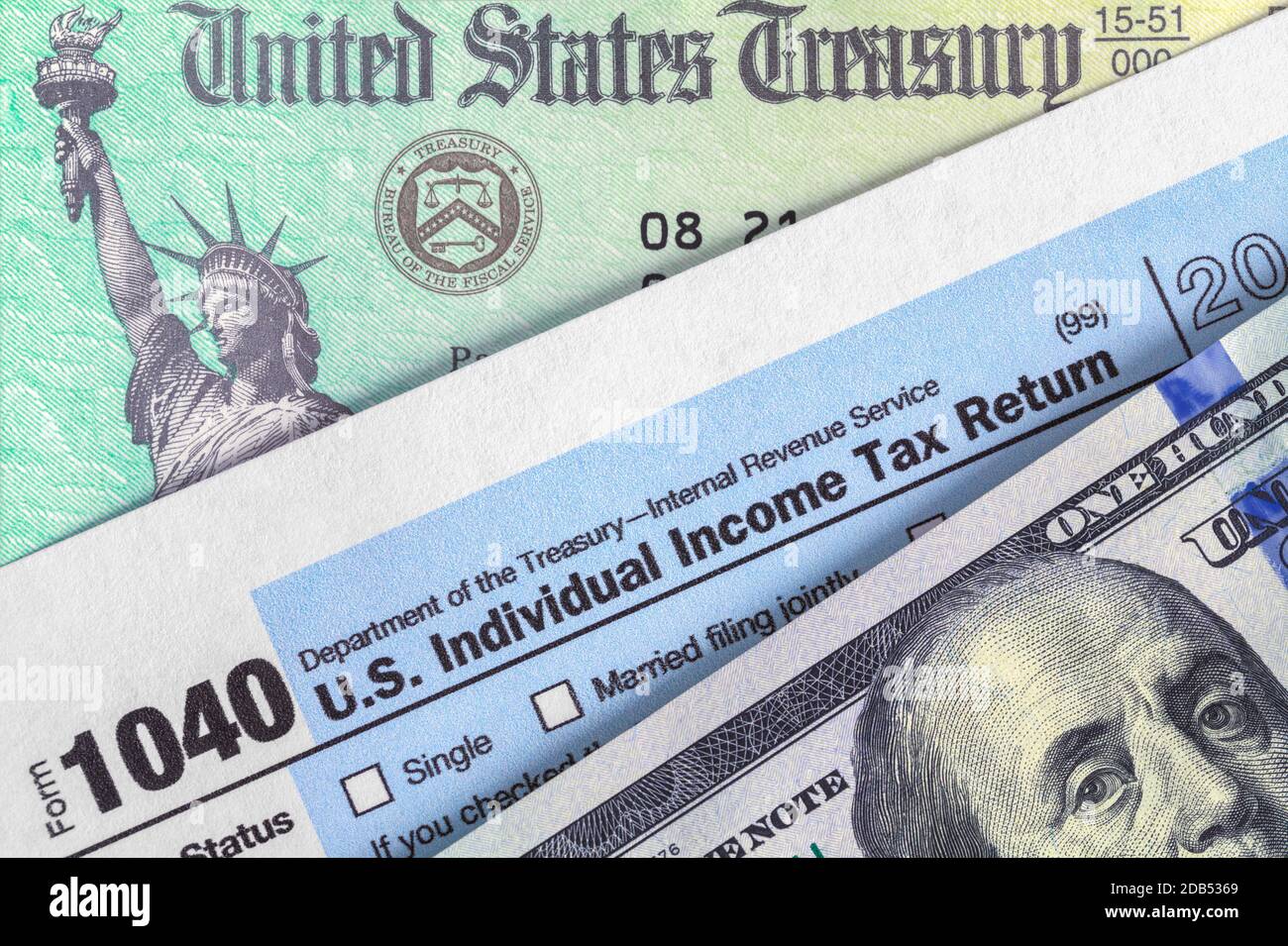 Form 1040 with Tax Refund Check and Money Stock Photo