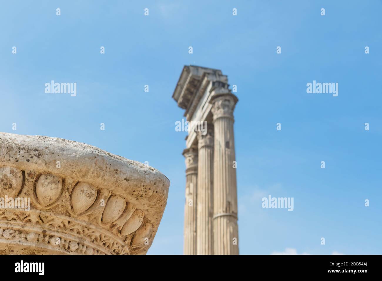Pillar ruins and the iconic three columns in Forum Romanum. Rome. Italy ...