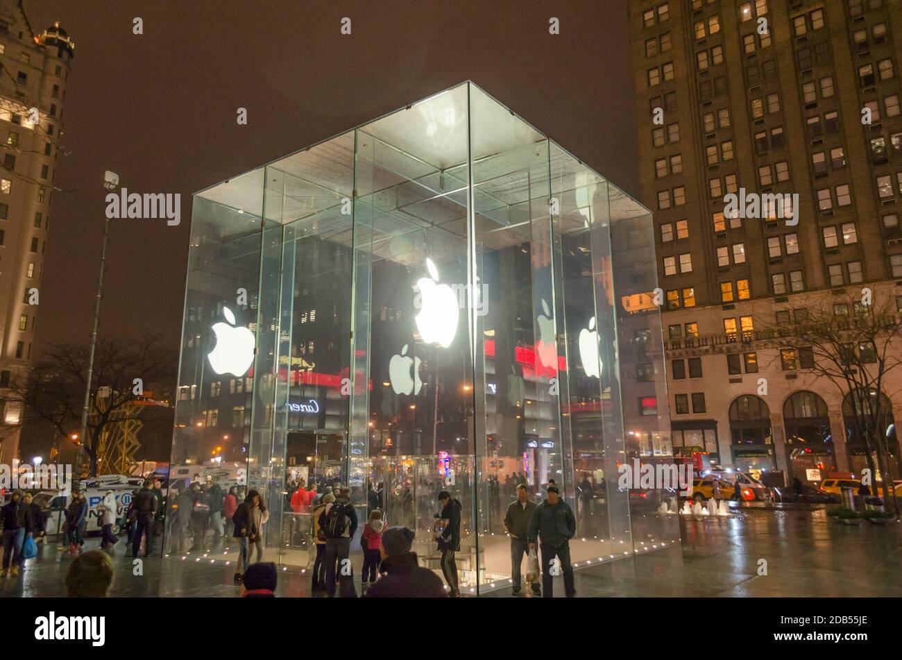 Apple Store Glass Cube Entrance in Manhattan. Futuristic Extrerior with the Impressive Illuminated White Logo. One of NYC’s Most Recognized Landmarks. Stock Photo