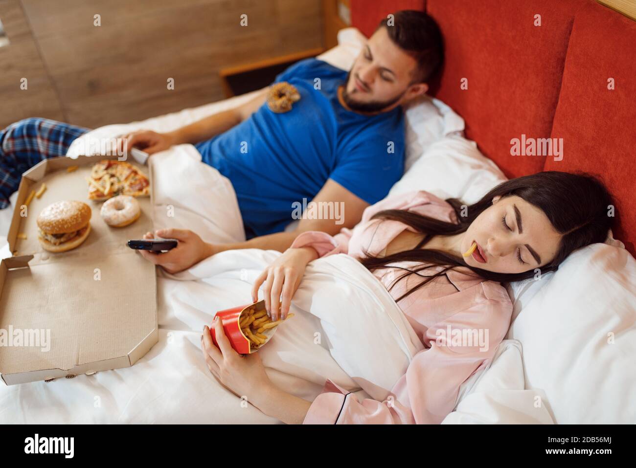 Couple eating in bed, bad relationship, problems, family quarrel, conflict of married man and woman