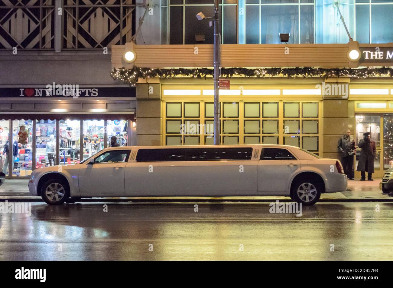 A White Limousine is Waiting Outside a Hotel Entrance in Midtown Manhattan. New York City, USA Stock Photo