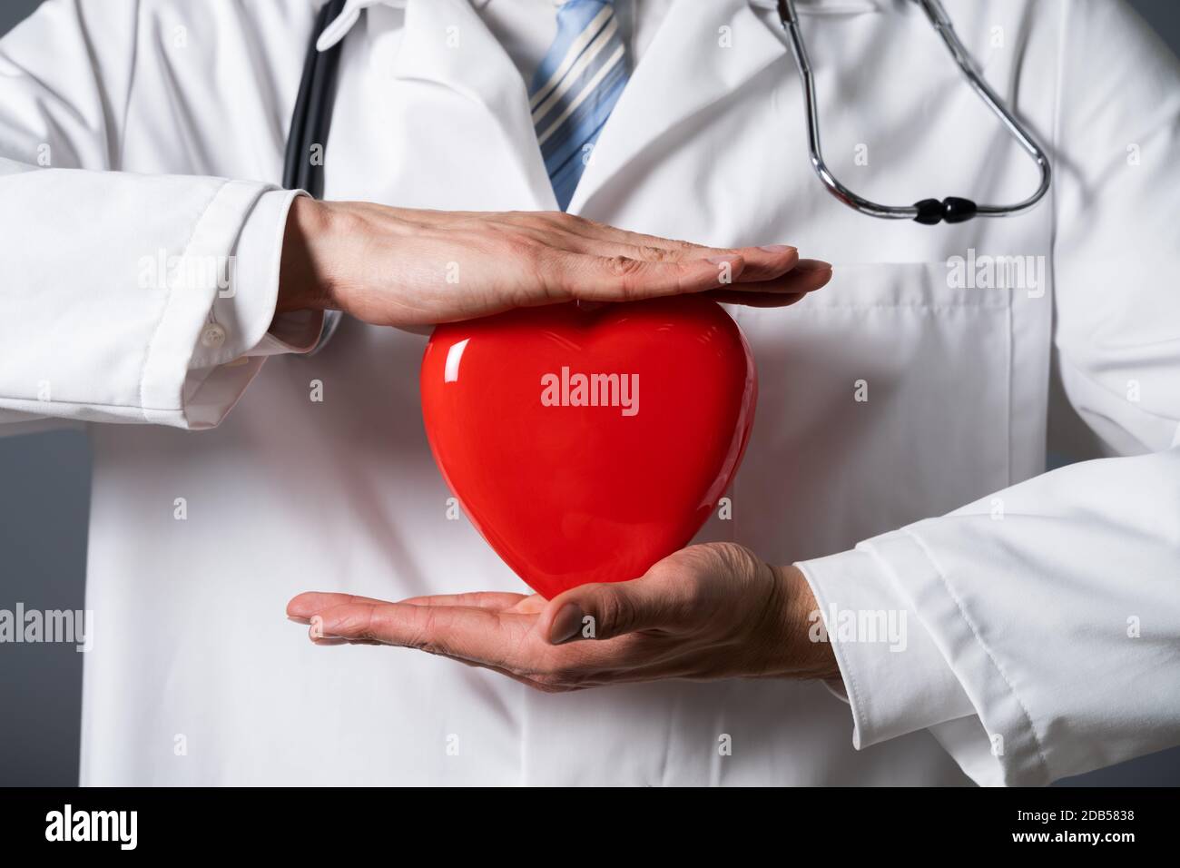 Midsection Photo Of Doctor Holding Red Heart Stock Photo - Alamy