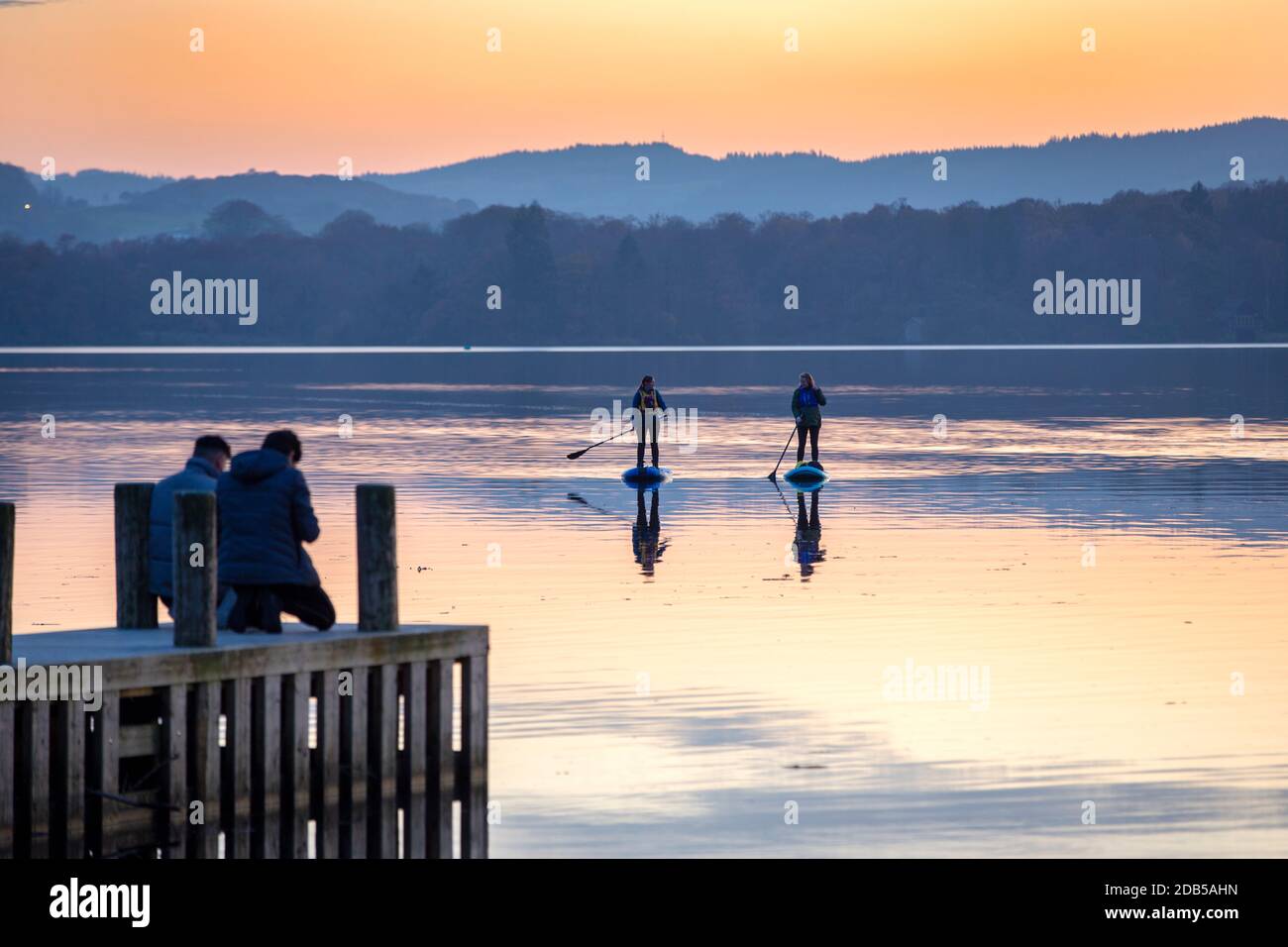 Lake Windermere at sunset, Ambleside, Lake District, UK with women