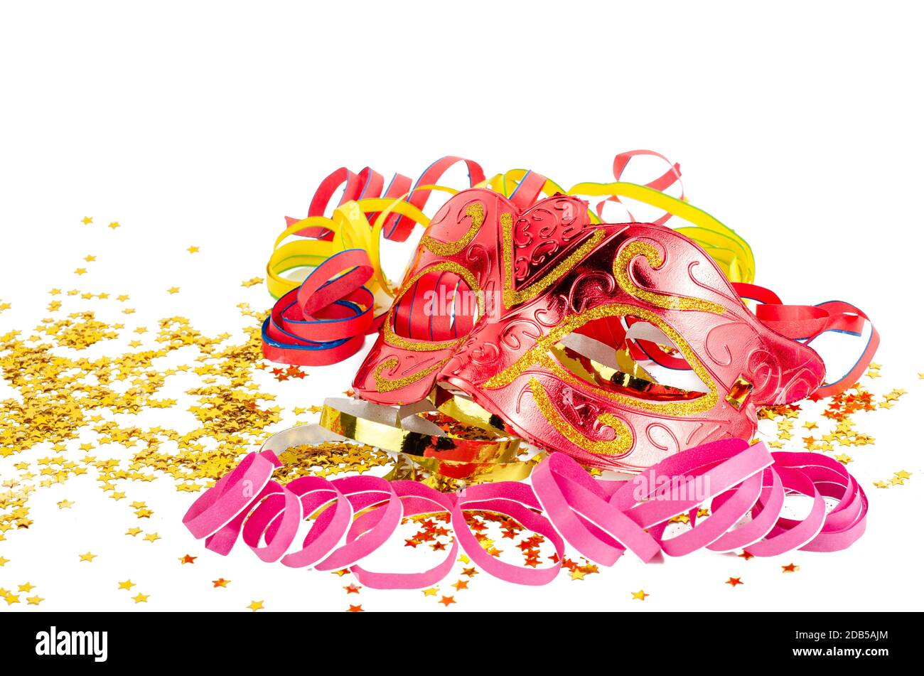 red mask with confetti and streamers isolated on a white background. Stock Photo