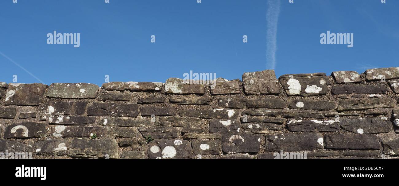 wide grey stone wall useful as a background Stock Photo - Alamy