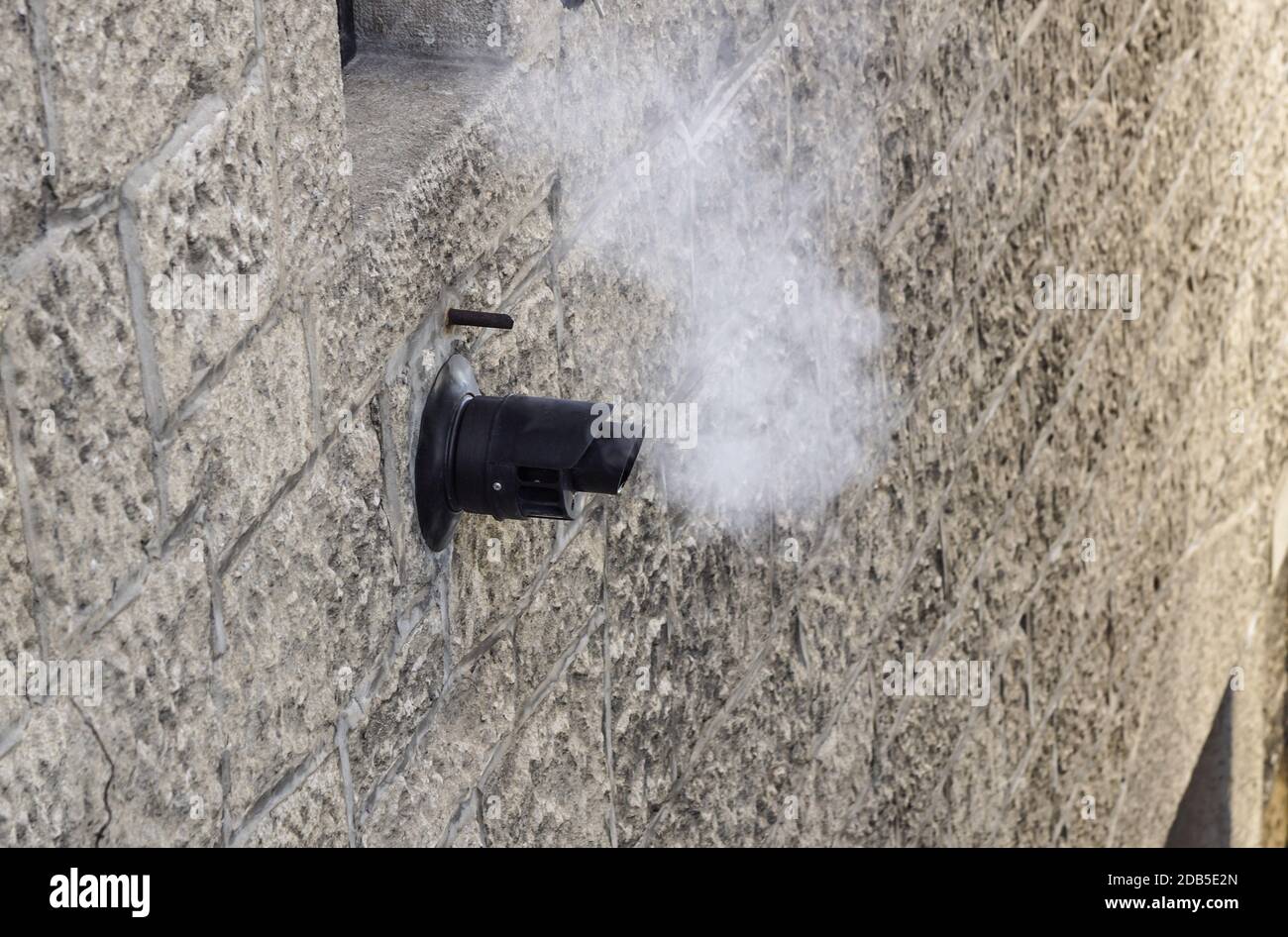 Chimney for smoke outlet on the wall. Forced circulation airtight