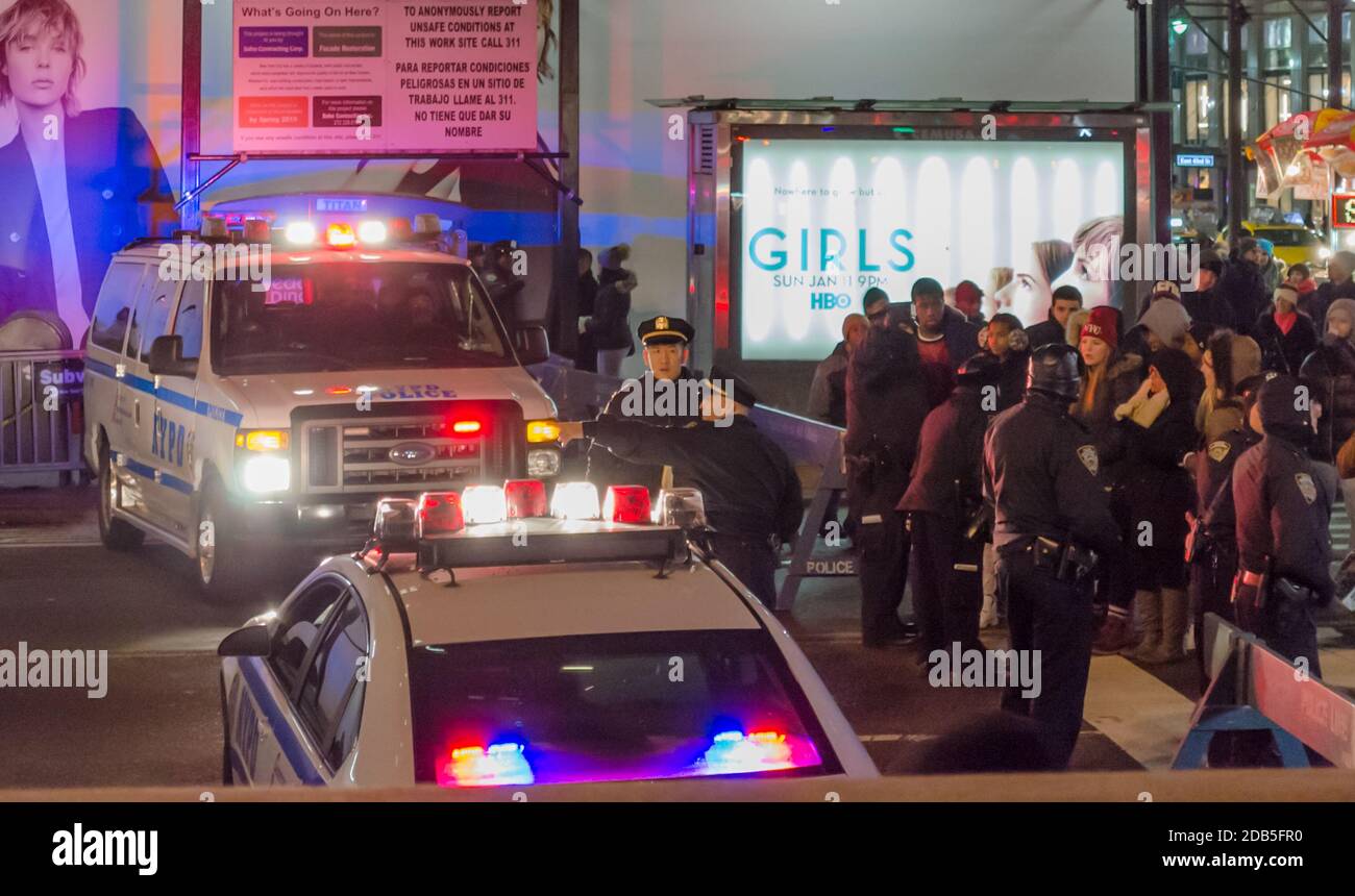 NYPD Police Vehicles and Officers Blocked the Road Due to New Years Eve Celebrations in Times Square, Manhattan. People Wait to Pass. New York, USA Stock Photo