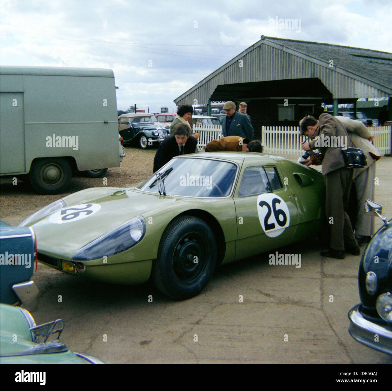 Innes Ireland’s Porsche 904 in the paddock at Silverstone on Practise Day 1st May 1964. Green colour was the hallmark of the Stirling Moss Racing Team Stock Photo
