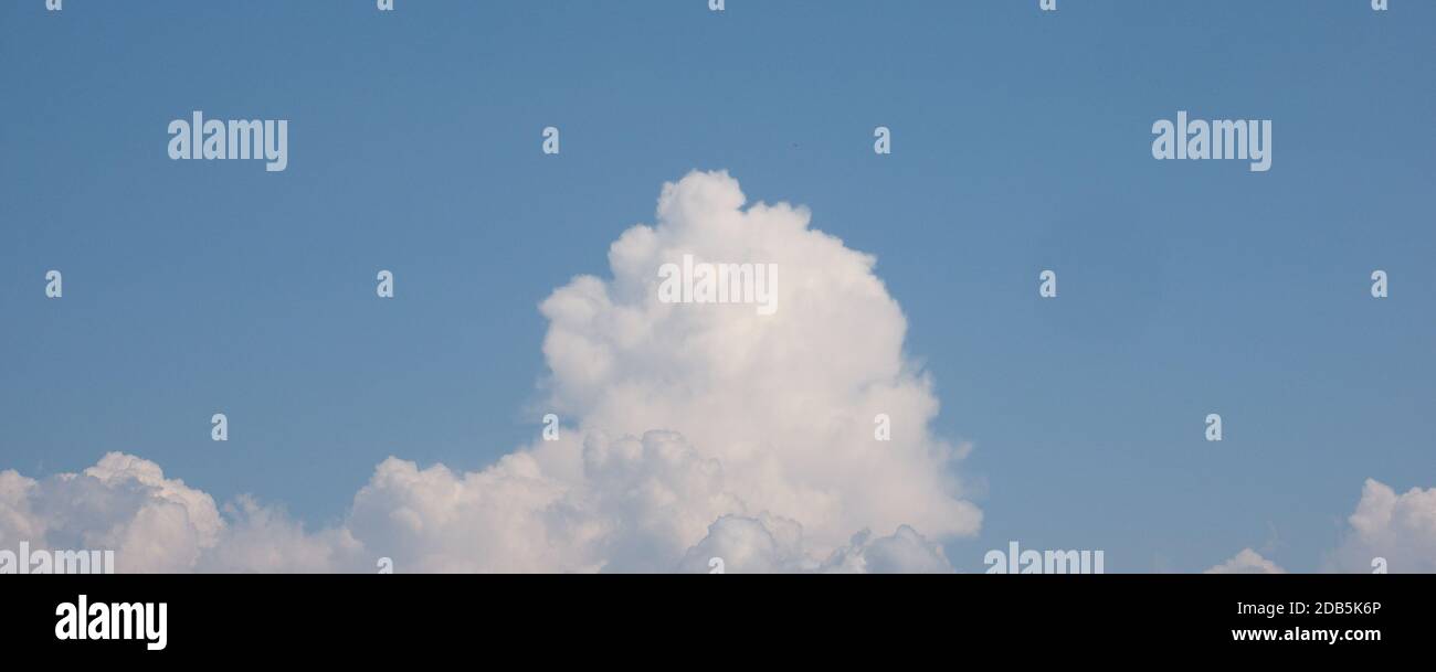 blue sky with clouds useful as a background Stock Photo - Alamy