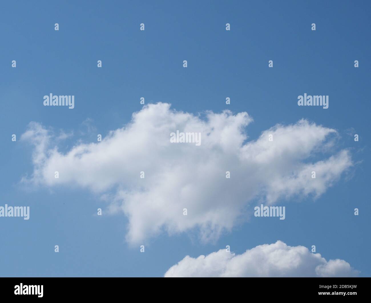 blue sky with clouds useful as a background Stock Photo - Alamy