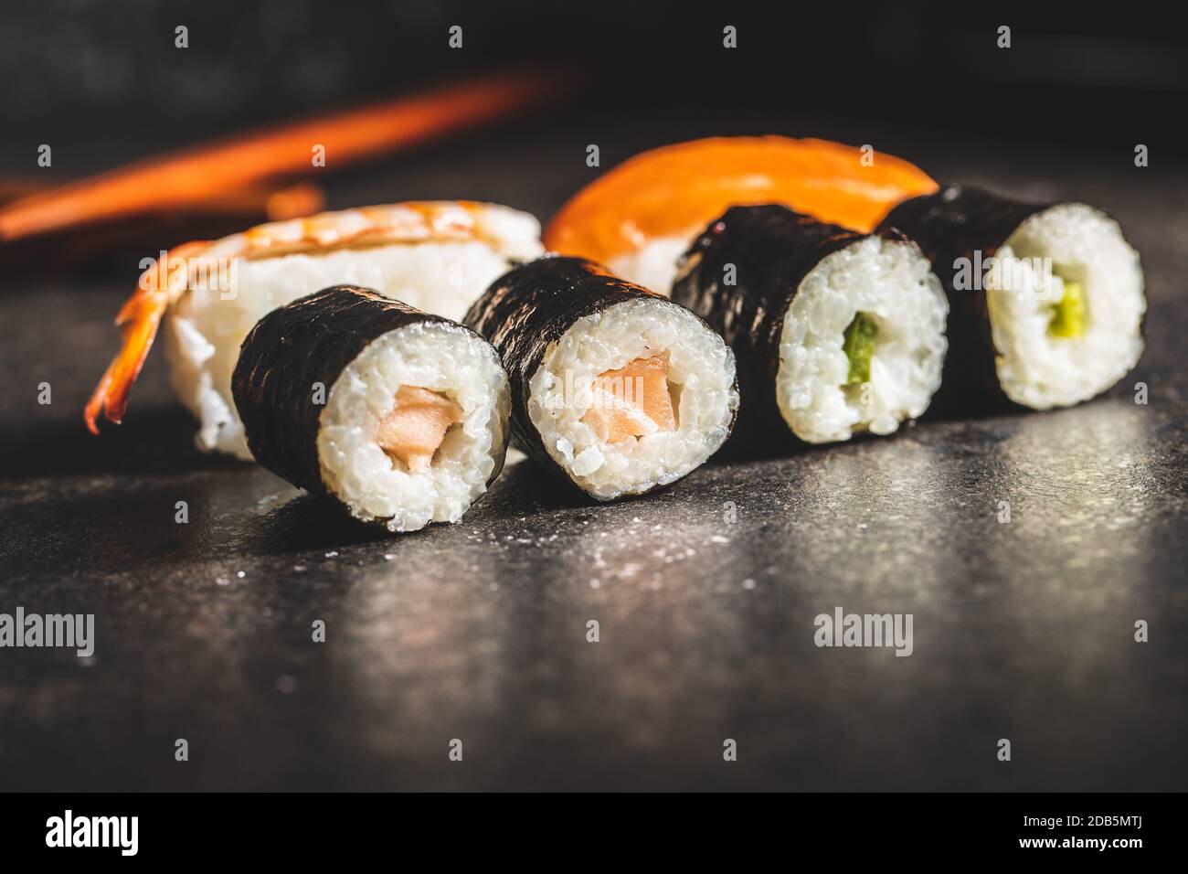Japanese sushi food. Maki and nigiri roll sushi with salmon, caviar, avocado and tuna. Stock Photo