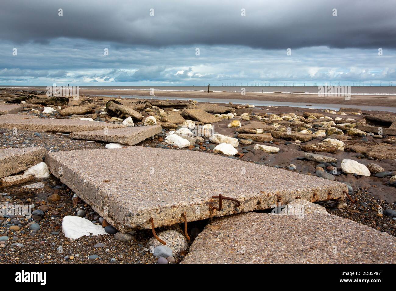 Coastal erosion breaking up old sea defences on Spurn point on Yorkshires East Coast, UK. This section of coastline is the fastest eroding coastline i Stock Photo