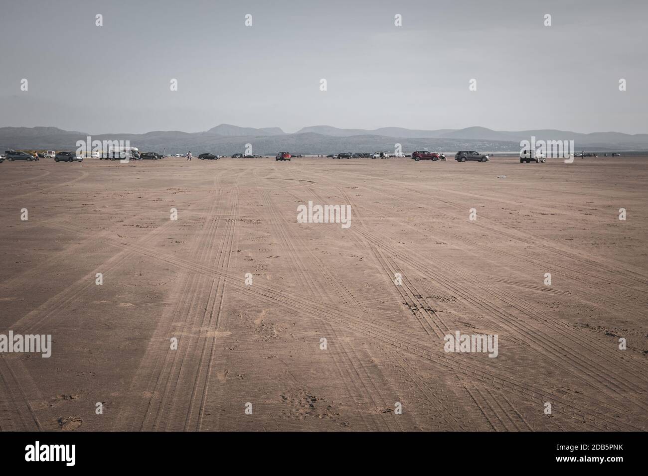 Cars parked on Black Rock Sands beach at early autumn in North Wales