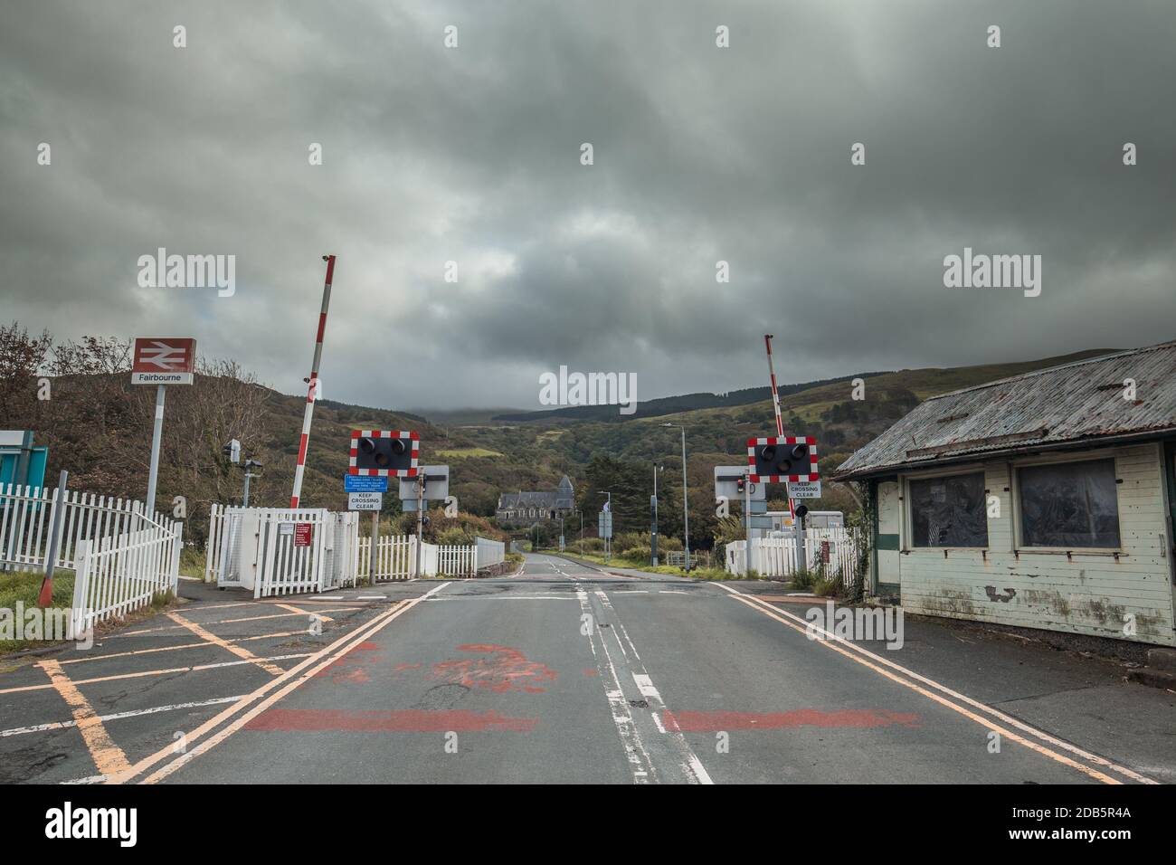 Empty railroad crossing at cloudy day in Fairbourne, North Wales, United Kingdom Stock Photo