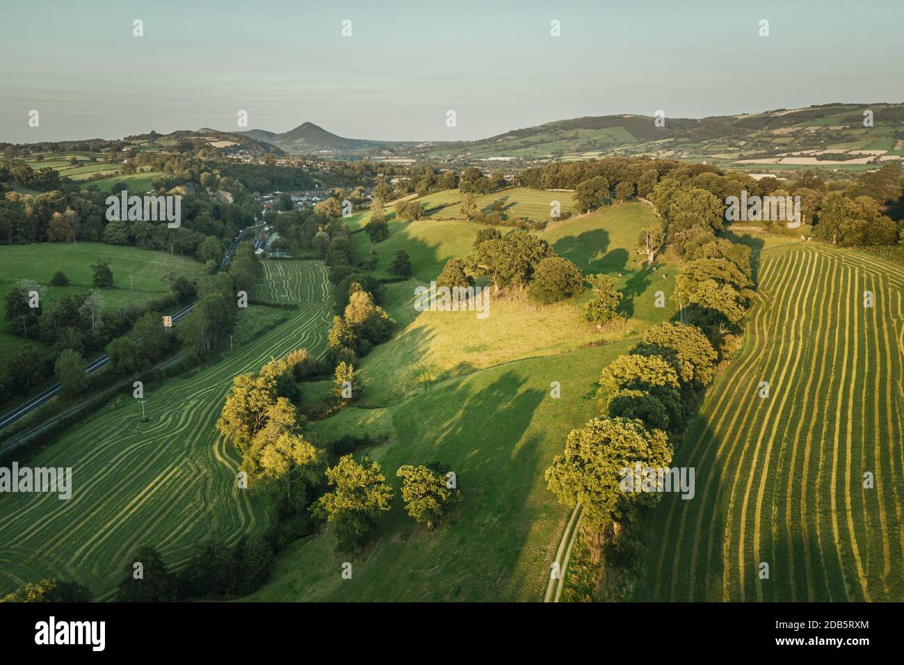 Aerial view over hilly farming fields at late summer near Welshpool in United Kingdom Stock Photo