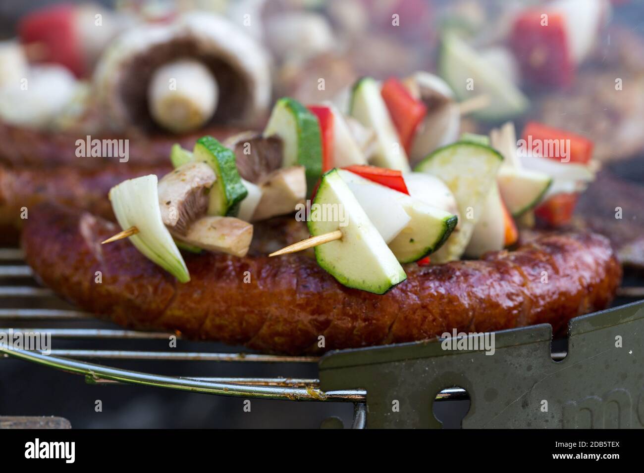 barbecue with delicious grilled meat and vegetables on grill Stock ...