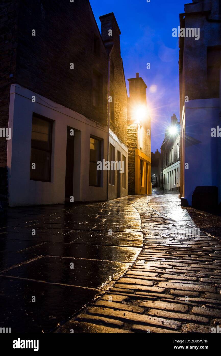 Low angle view of narrow romantic street on Orkney town at night Stock Photo