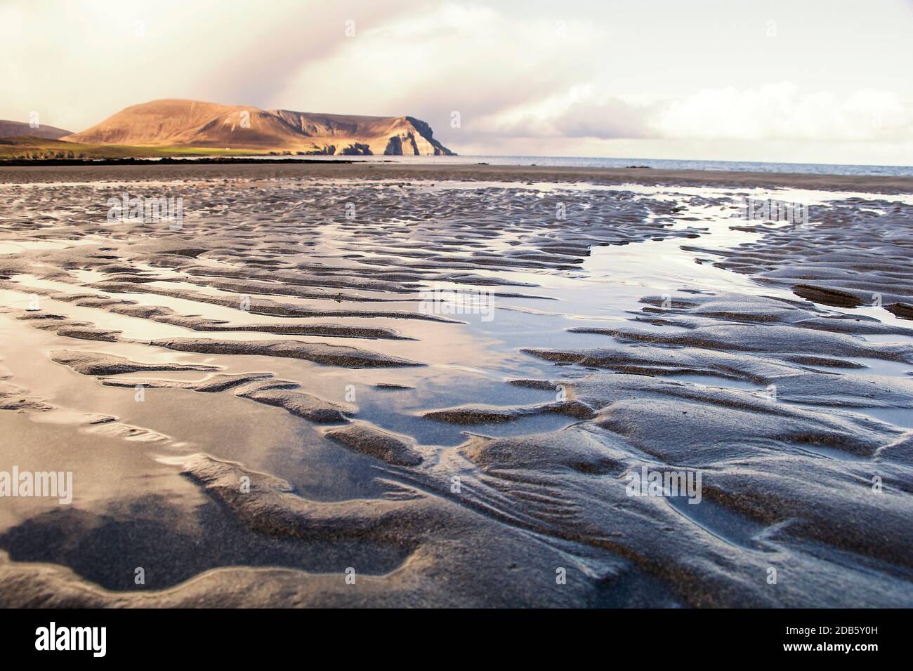 Closeup of ripples on sandy beach during low tide Stock Photo