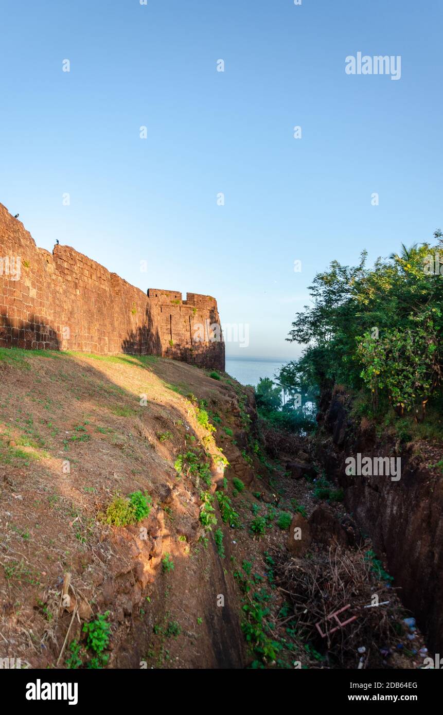 Exterior view of Cabo de Rama Fort surrounded by a moat (Khandak) where crocodiles were said to have been kept for protection from enemy attacks. Stock Photo