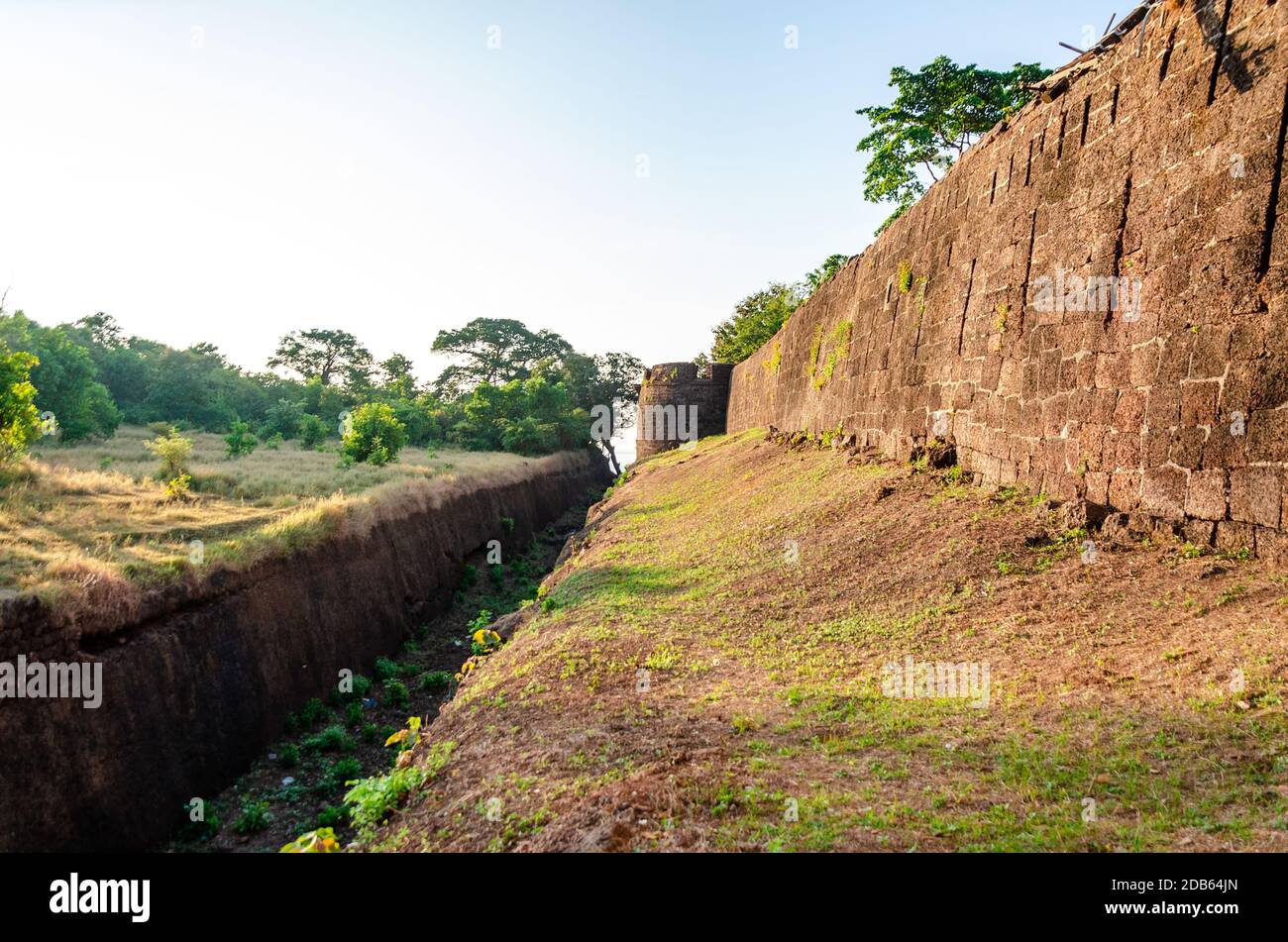 Exterior view of Cabo de Rama Fort surrounded by a moat (Khandak) where crocodiles were said to have been kept for protection from enemy attacks. Stock Photo