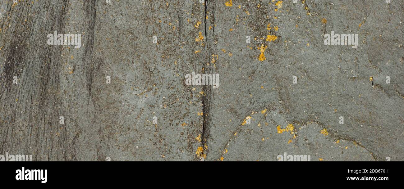 grey stone wall useful as a background Stock Photo - Alamy