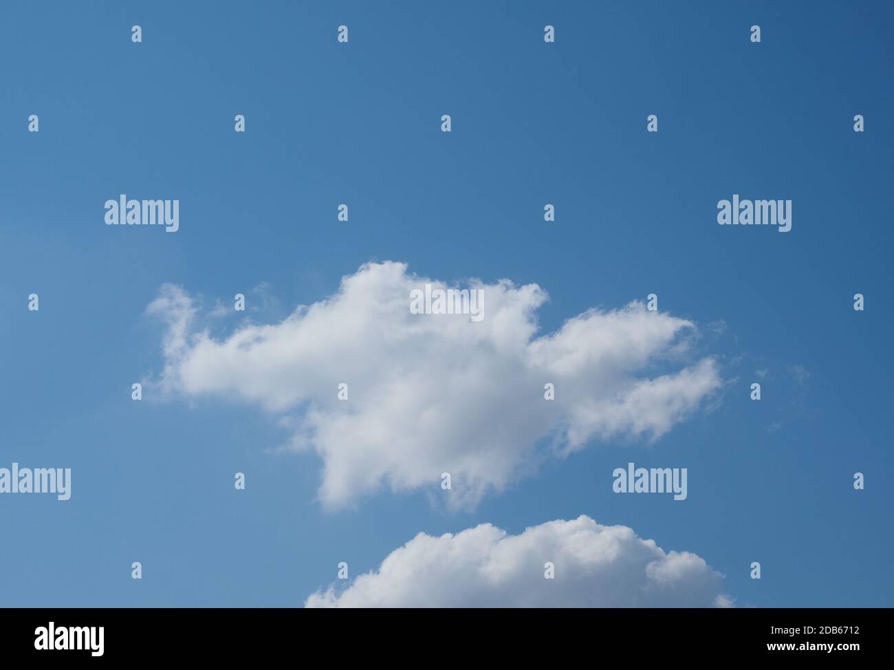 blue sky with clouds useful as a background Stock Photo - Alamy