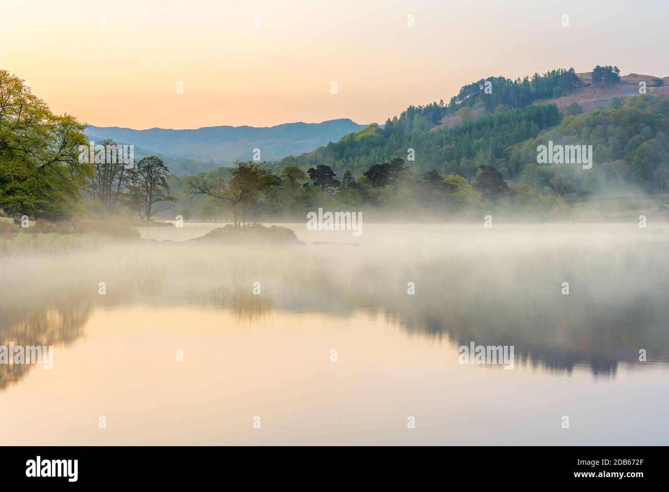 Misty spring morning at Rydal Water in the English Lake District with ...
