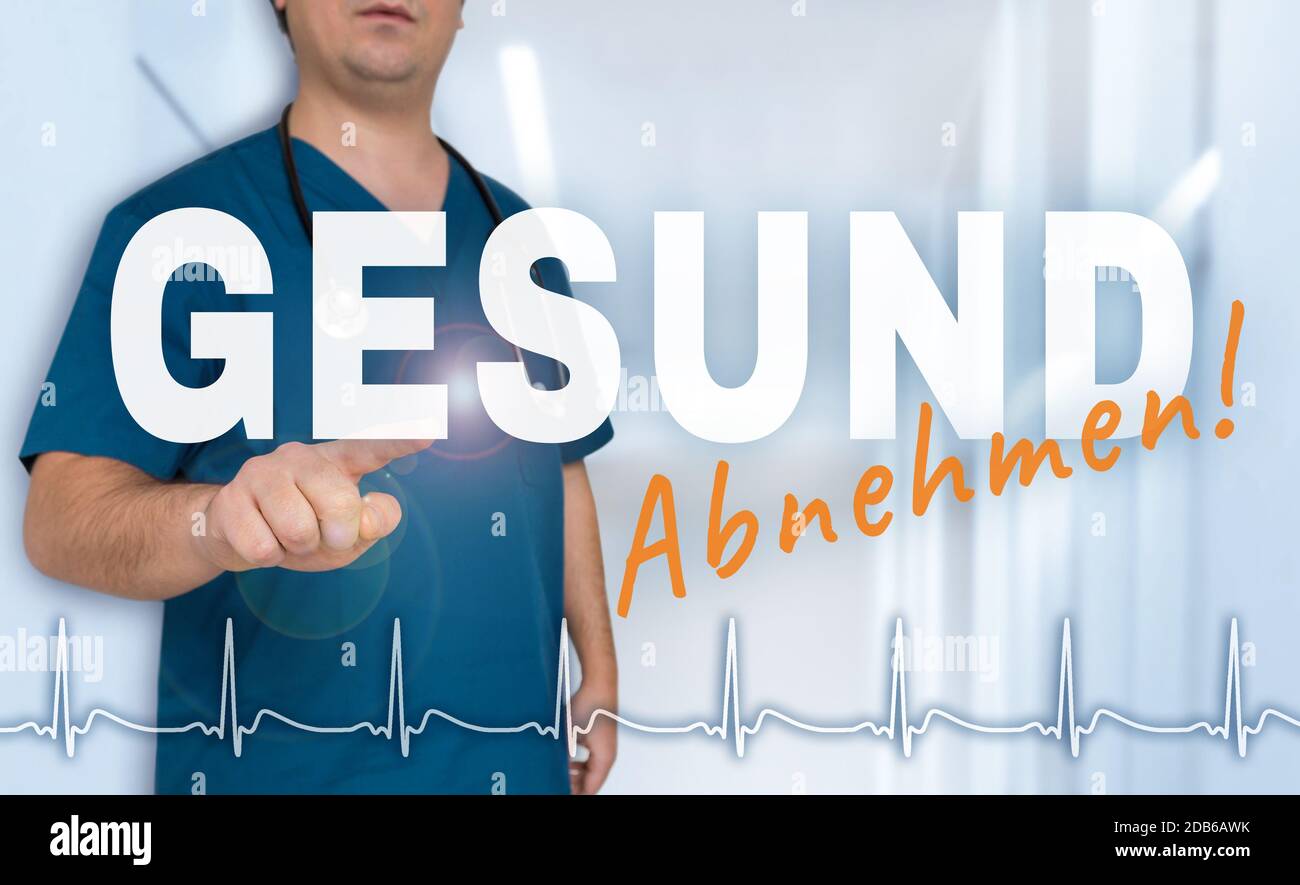 Gesund Abnehmen (in german Healthy slimming) doctor shows on viewer with heart rate concept. Stock Photo