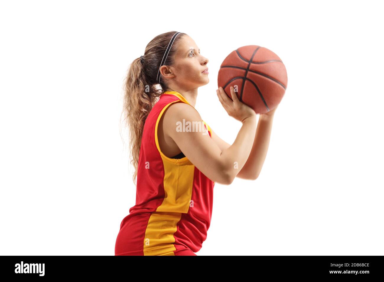 Female basketball player shooting a ball isolated on white background