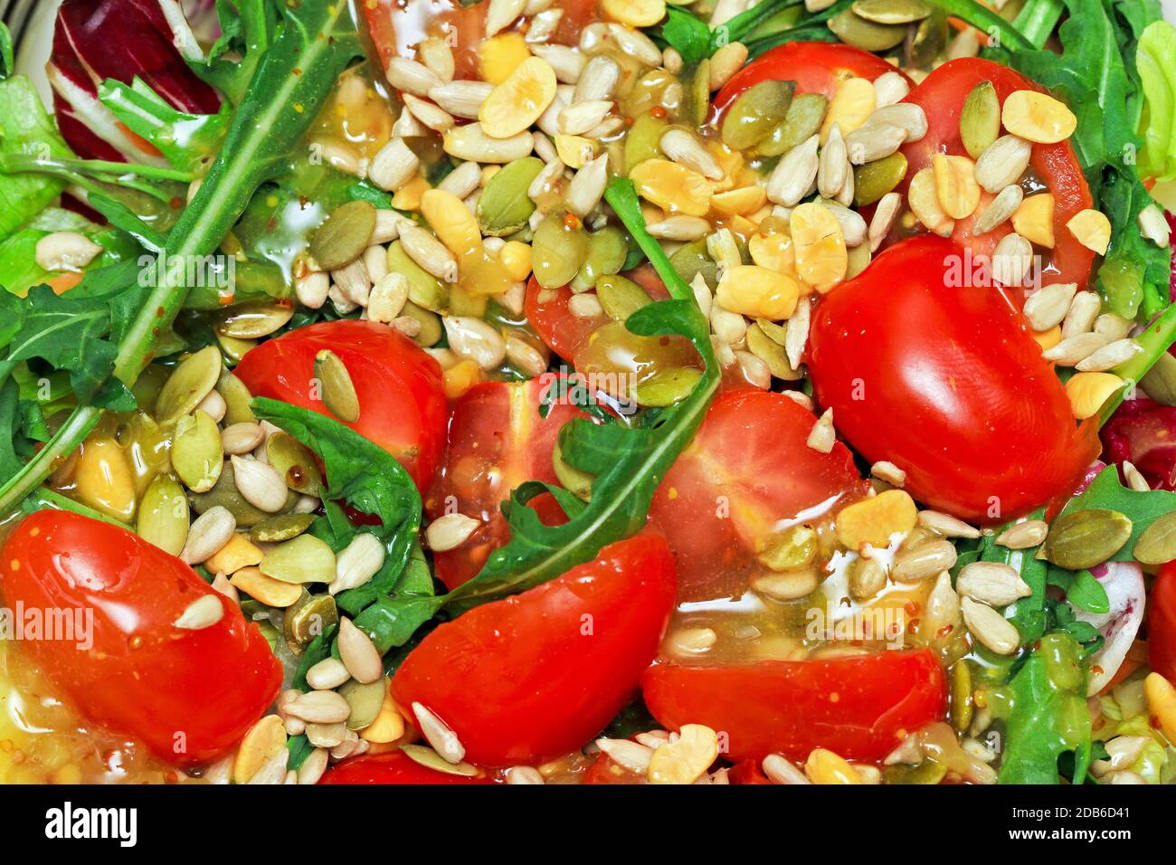 Tomato and rocket salad with honey and mustard Stock Photo - Alamy