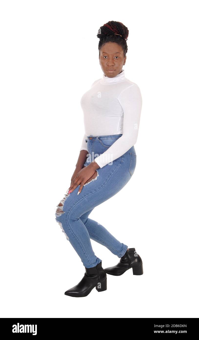 A young African American woman standing in jeans bending backwards,  isolated for white background Stock Photo - Alamy