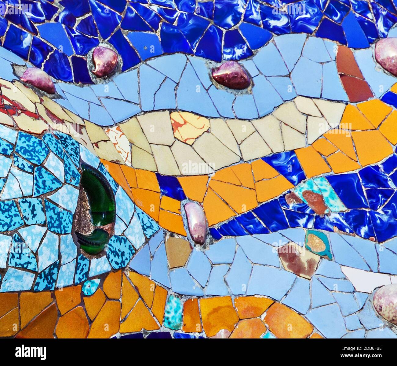 texture mosaic of colored ceramic tile by Antoni Gaudi at his Parc
